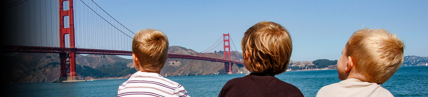 A group of children look upon California's Golden Gate Bridge
