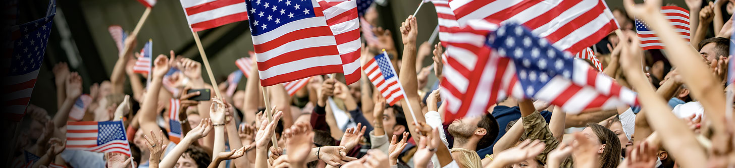 Patriotic citizens waving United States flags